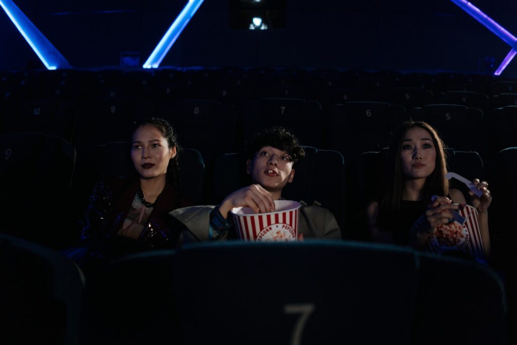 Three people in a cinema